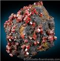 Vanadinite on Goethite from Taouz, Erfoud, Morocco.